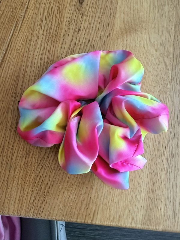 Close-up of the Gradient scrunchie with the colour gradients in the satin clearly visible
